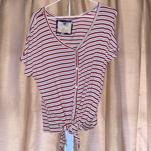 Red white blue striped shirt.